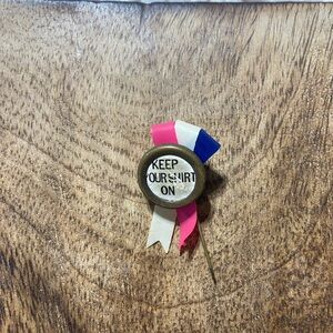 Rare VTG rosette ribbon pin phrase "KEEP YOUR SHIRT ON"